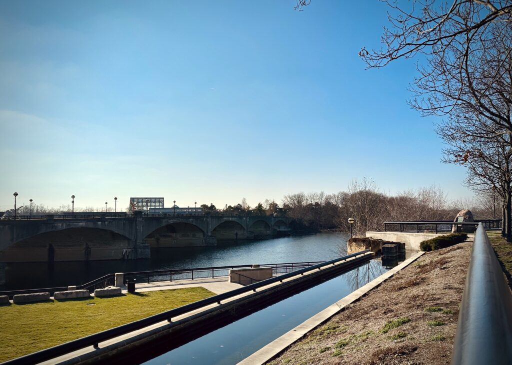 View of Central Canal where it dumps its water into the White River. There's also an old bridge going over the river that's now only for pedestrians.